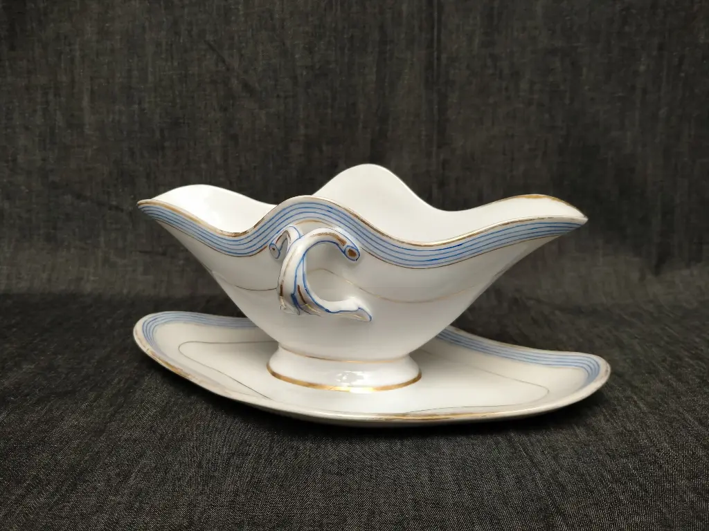 Saucière en porcelaine de Paris décor bleu et rehaut or XIXe siècle 