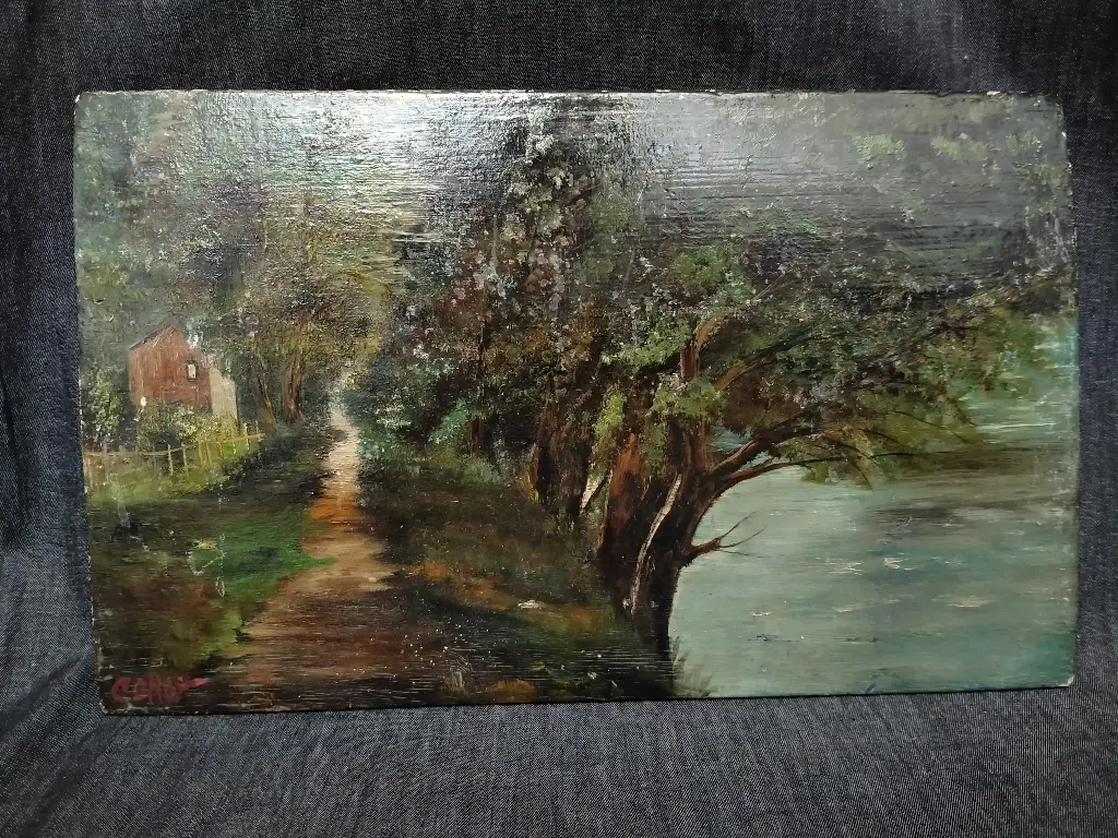 Huile sur panneau représentant une allée boisée au bord de l'eau signée Corot 