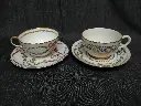 Tête à tête paire de tasses avec leurs sous tasses en porcelaine décor main de fleurs et rehaut or 